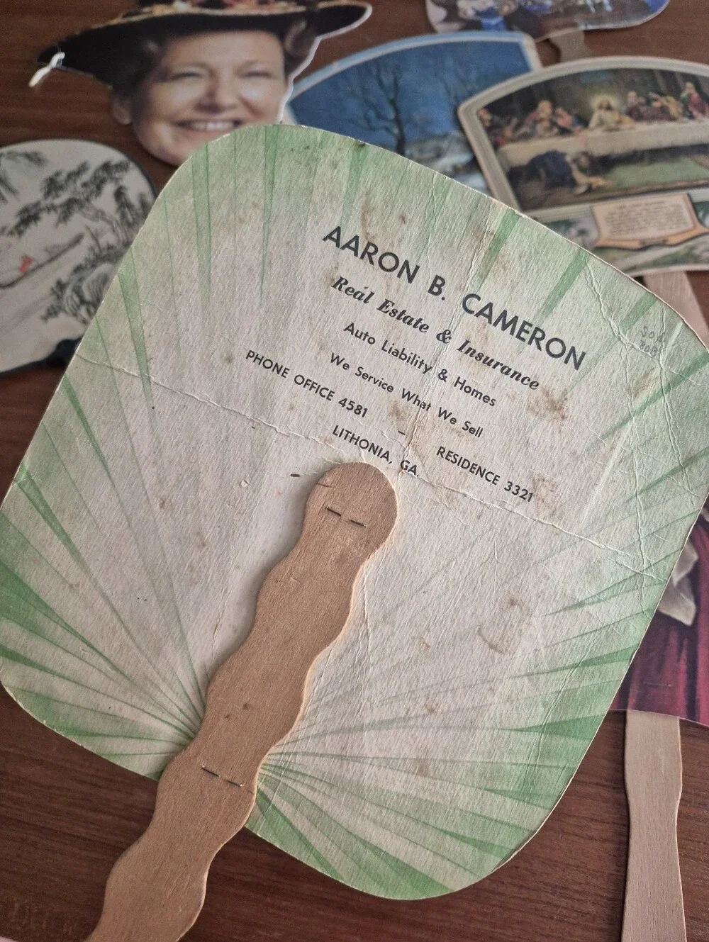 Assorted vintage advertising fans